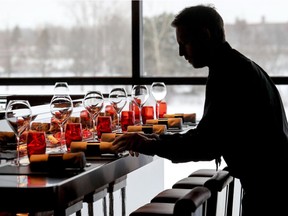 Waiter Benoit Tanguay prepares place settings at L’Atelier de Joël Robuchon at the Casino de Montréal on March 15, 2017.