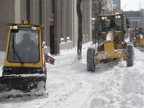 Work crews clean snow on Drummond St. on Thursday March 16, 2017. By Friday, all major arteries are expected to be cleared.