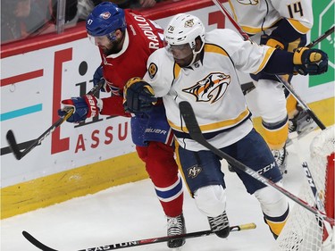 Montreal Canadiens' Alexander Radulov (47) tries to sneak past Nashville Predators' P.K. Subban (76), during first period NHL action in Montreal on Thursday March 2, 2017.