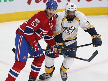 Montreal Canadiens' Max Pacioretty (67) and Nashville Predators' P.K. Subban (76) get in close, during first period NHL action in Montreal on Thursday March 2, 2017.