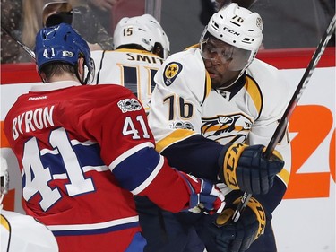 Montreal Canadiens' Paul Byron (41) and Nashville Predators' P.K. Subban (76) mix it up during second period NHL action in Montreal on Thursday March 2, 2017.