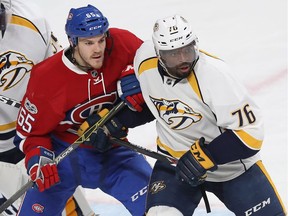 Canadiens' Andrew Shaw battles Predators' P.K. Subban in front of the Nashville net earlier this month. Shaw excels at getting under the skin of opponents and admits he has a tendency to "piss people off."