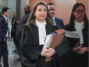 Crown prosecutor Sabrina Delli-Fraine leaves court following stay of proceedings on charges against 36 individuals arrested in Project Clemenza, in Montreal Tuesday, March 21, 2017.