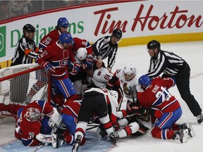 A scuffle breaks out around the Canadiens net during second period NHL hockey action against the Ottawa Senators in Montreal on Saturday, March 25, 2017.