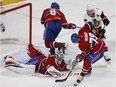 Canadiens goaltender Carey Price makes a save as teammate Andrei Markov comes in for the puck followed by Ottawa Senators' Kyle Turris (7) in Montreal on Saturday, March 25, 2017.