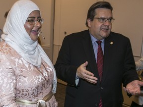 Fariha Naqvi-Mohamed and Montreal Mayor Denis Coderre chat with Muslim community leaders in Dollard-des-Ormeaux on March 28.