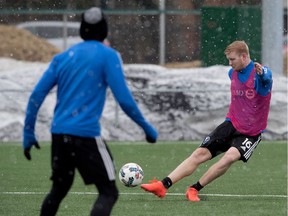 Impact midfielder Calum Mallace plays the ball during a blustery two-hour practice on Wednesday, March 29, that included brief periods of snow.