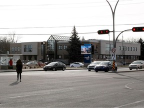 A pedestrian crosses the intersection on St-Jean Blvd. near Pointe-Claire city hall.