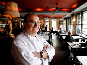 Chef Christian Darroman in the dining room at Café Cherrier, which boasts a retro '80s feel.