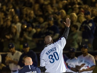 Former Montreal Expos Tim Raines waves to the fans prior to the start of the Pittsburgh Pirates - Toronto Blue Jays pre-season game at Olympic Stadium in Montreal, on Friday, March 31, 2017.