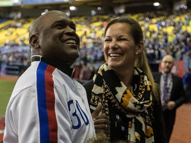 Former Montreal Expos Tim Raines and his wife Shannon Watson are all smiles prior to the start of the Pittsburgh Pirates - Toronto Blue Jays pre-season game at Olympic Stadium in Montreal, on Friday, March 31, 2017.