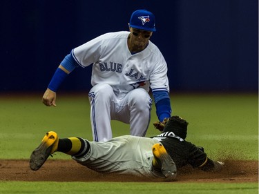 Pittsburgh Pirates Josh Harrison is tagged out by Toronto Blue Jays Troy Tulowitzki during 2nd inning action at Olympic Stadium in Montreal, on Friday, March 31, 2017.