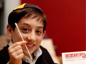 Gavi Aspler, 12, is raising awareness and funds for an organization called Gift of Life, a marrow and blood stem cell donor registry based in Florida. He is seen with a test swab in his home in Montreal on Tuesday March 7, 2017. Aspler, along with family and friends, will be hosting a donor drive on Saturday where cheek swabs will be collected and forwarded to Gift of Life in the hopes of finding a donor match.