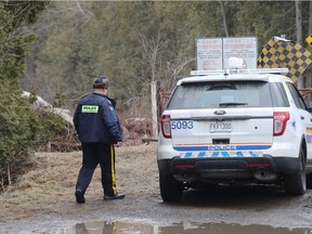 MONTREAL, QUE.: MARCH 7, 2017 -- RCMP officer at the Canadian - USA border on Roxham road in Saint-Bernard-de-Lacolle, near Hemmingford, Quebec Tuesday March 7, 2017. The road is used by Canadian refugee claimants arriving from the States. An RCMP officer was killed in the roadside accident on Monday evening while going to help colleagues dealing with refugees at the nearby border with the USA.(Pierre Obendrauf / MONTREAL GAZETTE) ORG XMIT: 58224- 1578