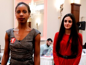 Former Quebec Immigration minister Yolande James, left and Emmannuella Lambropoulos enter the meeting to announce that Lambropoulos secured the Liberal Party of Canada nomination for the riding of Saint-Laurent in Montreal on Wednesday March 8, 2017.