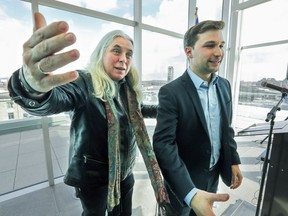 Quebec Solidaire MNA Manon Massé, left, welcomes colleagues into a photo with former student protest leader Gabriel Nadeau-Dubois, March 9, 2017.