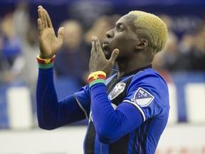 Montreal Impact's Ambroise Oyongo blows kisses to the crowd after scoring goal during second half action in game 1 of the MLS Eastern Conference final held at Olympic stadium in Montreal on Tuesday November 22, 2016 against Toronto FC. (Pierre Obendrauf / MONTREAL GAZETTE) ORG XMIT: 57595 - 0074