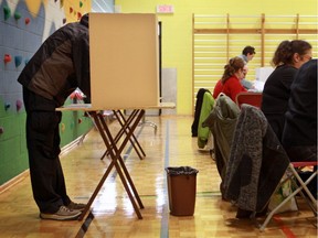 Voters cast ballots in advance polls in Montreal's municipal election in 2013.