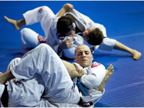 Etienne Georges trains in the the art of Brazilian jiu-jitsu with his rolling partner, Julien Casavant, at the Gracie Barra Montreal martial arts school in Montreal in 2013.