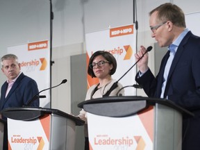 NDP leadership candidates Charlie Angus, left, and Niki Ashton, centre, listen to fellow candidate Peter Julian make a point during a leadership debate in Montreal, Sunday, March 26, 2017.