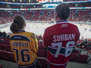 Fans wear jerseys of Nashville Predators' P.K. Subban and his former team the Montreal Canadiens during warm-up prior to facing the Montreal Canadiens in NHL hockey action, in Montreal on Thursday, March 2, 2017.