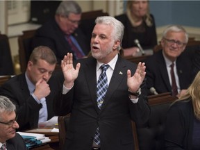 Quebec Premier Philippe Couillard responds to the Opposition during question period Tuesday, March 28, 2017 at the legislature in Quebec City.