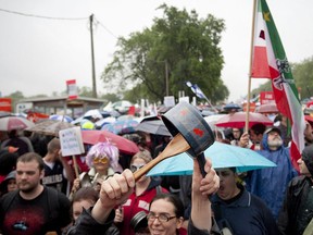 Protesters march in the rain through the streets of Montreal in support of the student strike and to protest against bill 78, June 2, 2012.