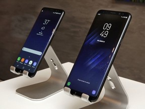 In this Friday, March 24, 2017, photo, new Samsung Galaxy S8, left, and Galaxy S8 Plus mobile phones are displayed in New York. The Galaxy S8 features a larger display than its predecessor, the Galaxy S7, and sports a voice assistant intended to rival Siri and Google Assistant.