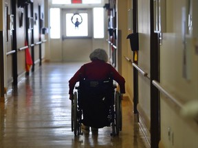 SHERBROOKE, QUE.: JANUARY 10, 2017 -- A elderly woman uses her wheelchair to travel a hallway at Wales Home on January 10, 2017.Wales Home is an award winning nursing home, an English language CHSLD, and the oldest nursing home in Quebec. It meets all the government standards and more. But the non-profit, private home is running a $1. 7 million deficit because it is not funded like public homes. It is currently negotiating new funding with the Quebec Health Departement  (Marie-France Coallier / MONTREAL GAZETTE)  ORG XMIT: 57886