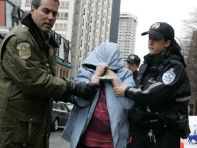 Suspect arrives at RCMP headquarters in Montreal on  Dec 19, 2006 following arrest in telemarketing raid early in the morning.