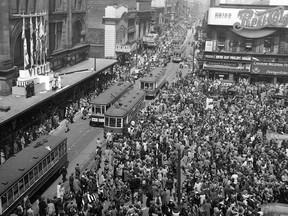 May 7, 1945: Germany has just surrendered and the war in Europe is unofficially over, so Montrealers celebrate on Ste. Catherine St., a day before victory is officially declared.