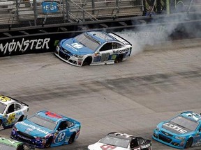Driver Dale Earnhardt Jr.(88) hits the wall as cars get past him during a NASCAR Monster Energy NASCAR Cup Series auto race, Monday, April 24, 2017, in Bristol, Tenn. (AP Photo/Wade Payne)