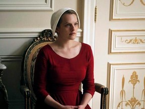 This image released by Hulu shows Elisabeth Moss as Offred in a scene from &ampquot;The Handmaid&#039;s Tale.&ampquot; &ampquot;The Handmaid&#039;s Tale&ampquot; is getting rave reviews ahead of Sunday&#039;s Canadian premiere on Bravo, including from the story&#039;s original author, Margaret Atwood.THE CANADIAN PRESS/George Kraychyk/Hulu via AP