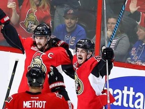 Ottawa Senators defenceman Erik Karlsson (65) celebrates his goal against the New York Rangers with teammates centre Jean-Gabriel Pageau (44) and defenceman Marc Methot (3) during the third period in game one of a second-round NHL hockey Stanley Cup playoff series in Ottawa on Thursday, April 27, 2017. THE CANADIAN PRESS/Fred Chartrand