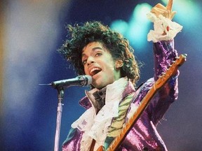 FILE - In this Feb. 18, 1985 file photo, Prince performs at the Forum in Inglewood, Calif. A pair of record labels announced Friday, April 28, 2017, that a remastered edition of Prince‚Äôs landmark 1984 album ‚ÄúPurple Rain‚Äù will be released on June 23, 2017. The labels say Prince oversaw the remastering process in 2015 and the ‚ÄúPurple Rain Deluxe‚Äù will include six previously unreleased songs by the late singer-songwriter, who died one year ago. (AP Photo/Liu Heung Shing, File)