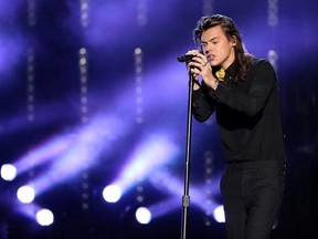 FILE - In this Nov. 22, 2015, file photo, Harry Styles of One Direction performs at the American Music Awards at the Microsoft Theater in Los Angeles. Styles announced a solo world tour on April 28, 2017, ahead of the May 12 release of his self-titled solo debut. (Photo by Matt Sayles/Invision/AP, File)