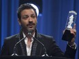Adam Cohen, son of Leonard Cohen accepts the award on behalf of his father for the Artist of the Year at the Juno Gala awards show in Ottawa, Saturday, April 1, 2017. Leonard Cohen died in Los Angeles on November 7, 2016.