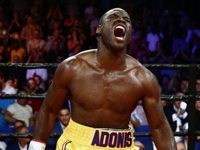 Adonis Stevenson celebrates after defeating Thomas Williams Jr. of the US. during their WBC light heavyweight championship fight at the Centre Vidéotron on July 29, 2016 in Quebec City.