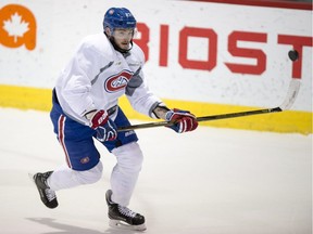 Montreal Canadiens' Alex Galchenyuk goes after a flying puck during a practice Monday, April 10, 2017 in Brossard, Que. The Canadiens will face the New York Rangers in the first round of playoffs.