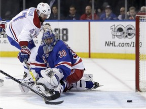 Montreal Canadiens' Alexander Radulov, left, scores a goal past New York Rangers goalie Henrik Lundqvist during the third period in Game 3 of an NHL hockey first-round playoff series, Sunday, April 16, 2017, in New York. The Canadiens defeated the Rangers 3-1.