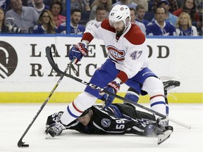 Montreal Canadiens right wing Alexander Radulov (47) gets by as Tampa Bay Lightning defenseman Jake Dotchin (59) loses his stick during the first period of an NHL hockey game Saturday, April 1, 2017, in Tampa, Fla.