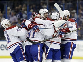 Montreal Canadiens right wing Alexander Radulov (47) celebrates with teammates after defeating the Tampa Bay Lightning during overtime in an NHL hockey game Saturday, April 1, 2017, in Tampa, Fla.