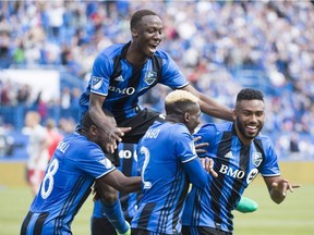 Impact's Anthony Jackson-Hamel, right, celebrates with teammates after scoring during second half MLS soccer action against Atlanta United, in Montreal on Saturday, April 15, 2017.
