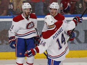 Montreal Canadiens left-wing Artturi Lehkonen (62) is congratulated by Paul Byron (41) and Tomas Plekanec after scoring a goal during the third period of an NHL hockey game against the Florida Panthers, Monday, April 3, 2017, in Sunrise, Fla. The Canadiens defeated the Panthers 4-1.