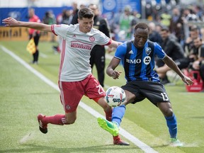 Montreal Impact's Ballou Jean-Yves Tabla, right, challenges Atlanta United's Mark Bloom during second half MLS soccer action in Montreal, Saturday, April 15, 2017.