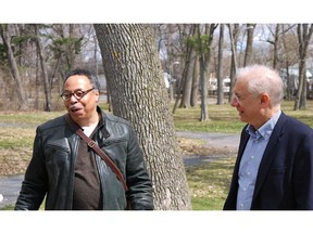 Canada's parliamentary poet laureate George Elliott Clarke and MP for Lac-St-Louis Francis Scarpaleggia enjoy the view of Lac St-Louis from the Centennial Hall grounds in Beaconsfield.