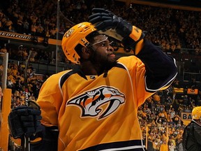 P.K.Subban of the Nashville Predators high fives teammate Yannick Weber  after a 4-1 victory in Game 4 of the Western Conference First Round against the Chicago Blackhawks during the 2017 NHL Stanley Cup Playoffs at Bridgestone Arena on April 20, 2017 in Nashville, Tennessee.