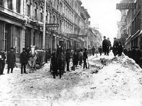 Clearing snow on Notre Dame St., Montreal, about 1887.