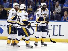 P.K. Subban, right, celebrates with teammates Ryan Ellis (4) and Kevin Fiala, of Switzerland, after Colin Wilson, not pictured, scored during the first period in Game 1 of an NHL hockey second-round playoff series, Wednesday, April 26, 2017, in St. Louis.