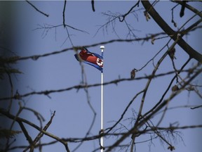 (FILES) This file photo taken on March 8, 2017 shows the North Korean national flag flying at the North Korean Embassy in Beijing. U.S. military confirms that North Korea fired a ballistic missile into the Sea of Japan on April 5, 2017.